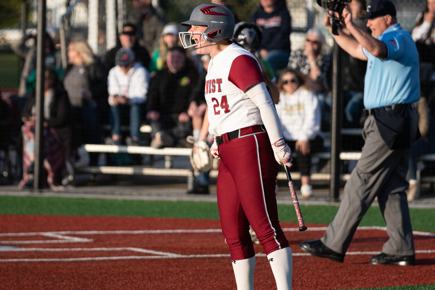 W.F. West's Savannah Hawkins yells after Brielle Etter's game-tying 2-RBI double in the seventh inning against Tumwater in the 2A District 4 championship game at Rec Park May 20.