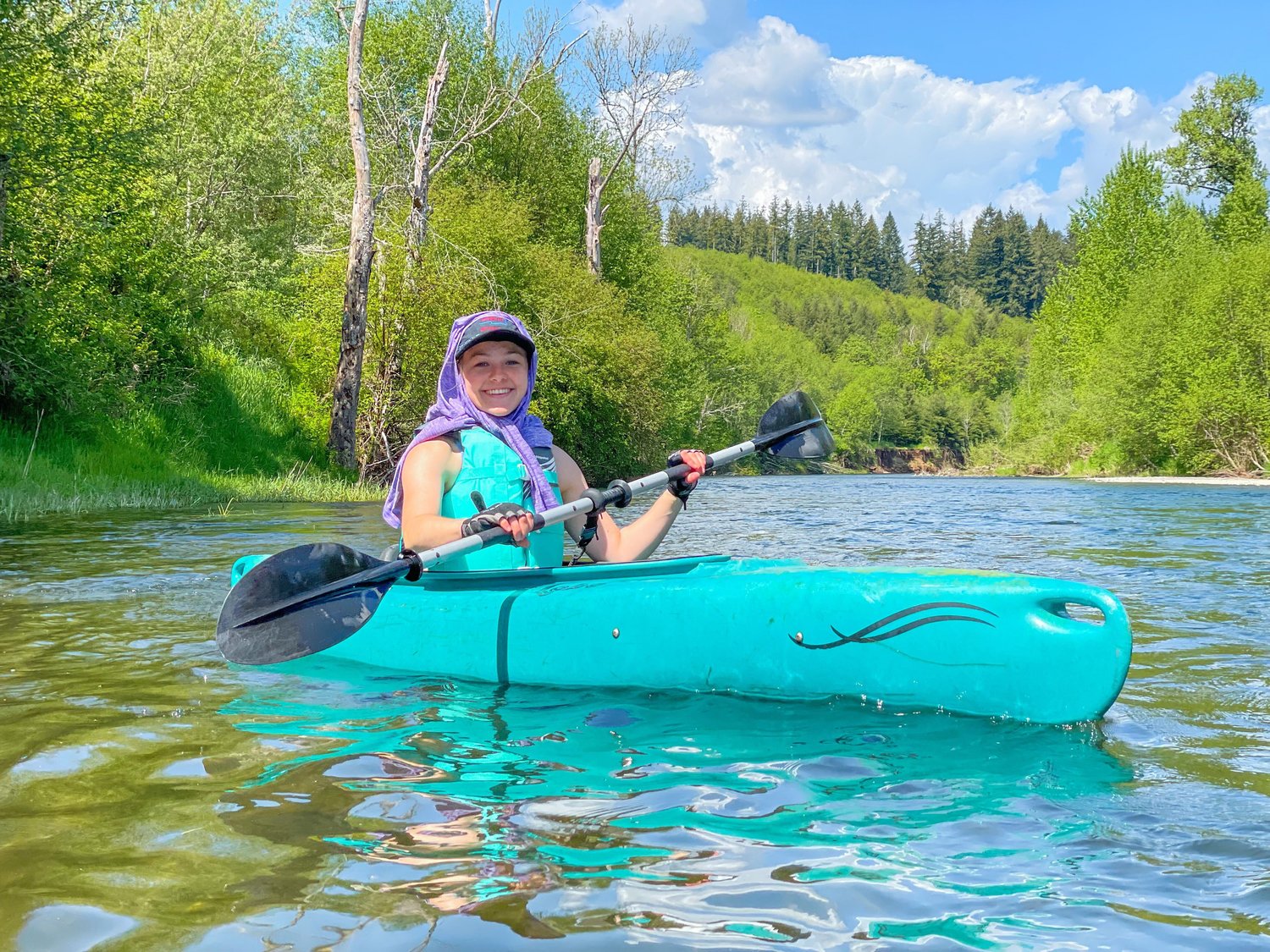 Reporter Isabel Vander Stoep smiles while paddling the Chehalis River near Doty on Saturday.