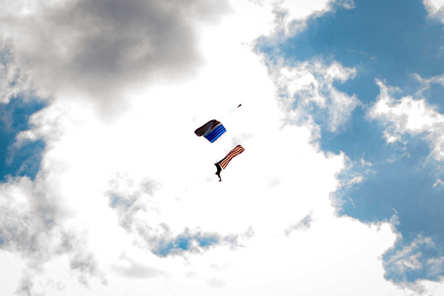 A skydiver from Skydive Toledo makes a jump over the Relay for Life event held at the Southwest Washington Fairgrounds Friday evening.