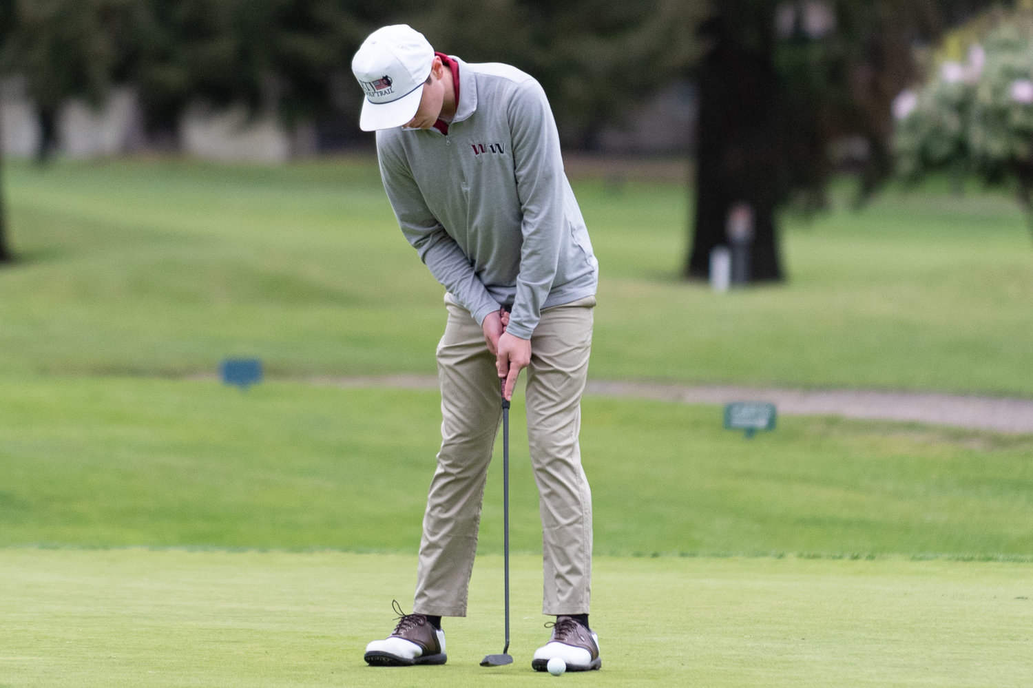 W.F. West golfer Ben Halverstadt hits a short put at Capital City Golf Course in Olympia at the 2A State Boys Golf Championships May 24.