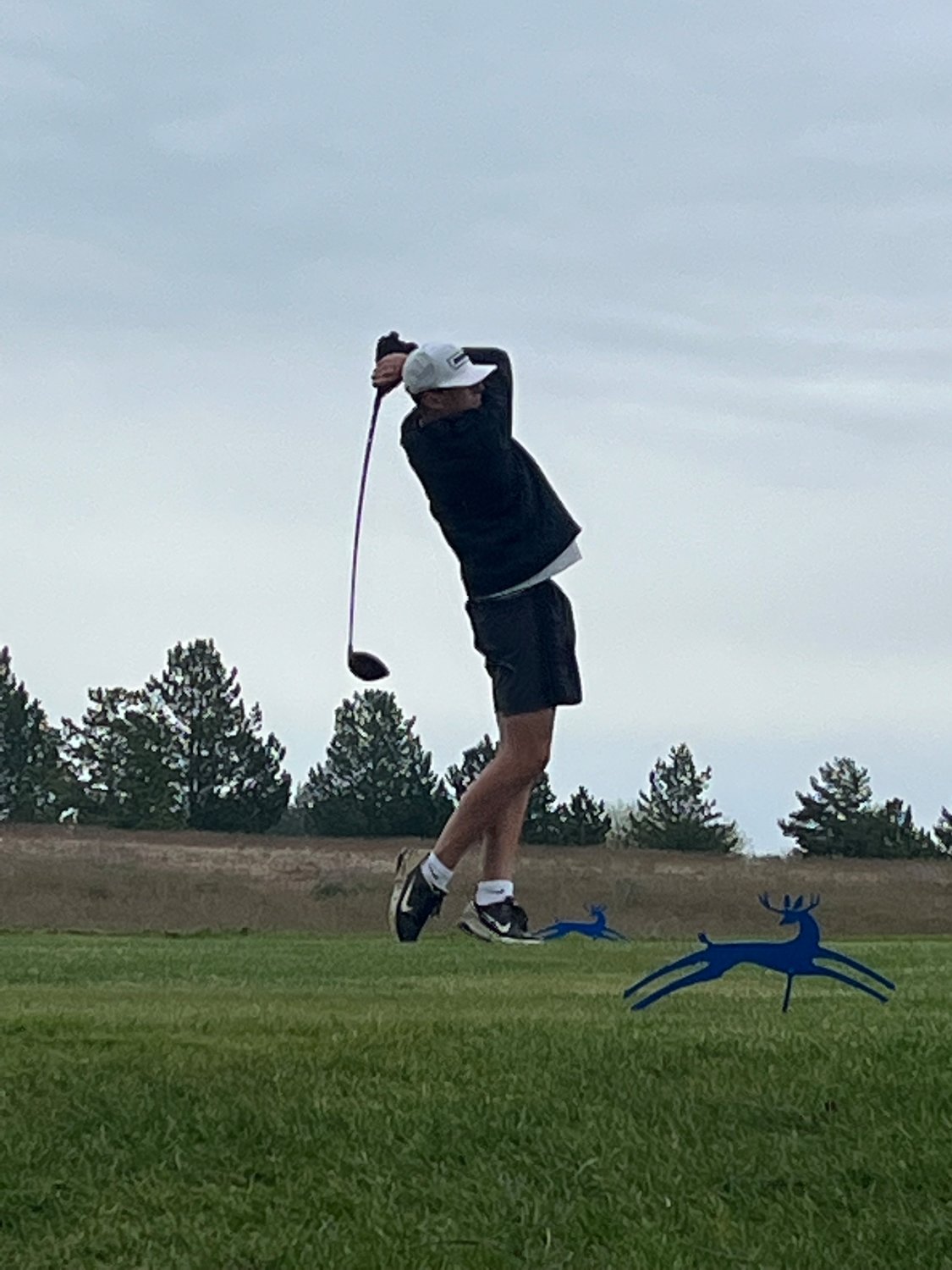 Adna golfer Braeden Salme watches his ball May 25 at Deer Park Golf Course in Spokane for the 2B State Golf Championships.