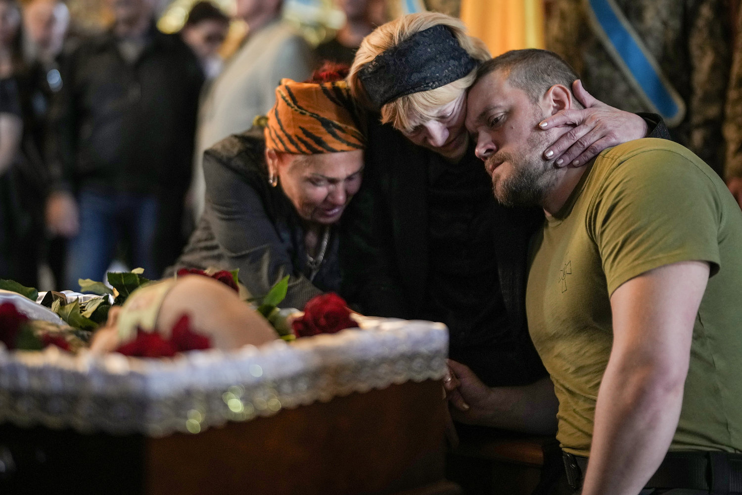Relatives, friends and comrades of Ukrainian soldier Eduardo Trepilchenko, who was killed on the Eastern front battling the Russian invasion , attend his funeral at St Michael's Cathedral on May 25, 2022 in Kyiv, Ukraine. (Christopher Furlong/Getty Images/TNS)