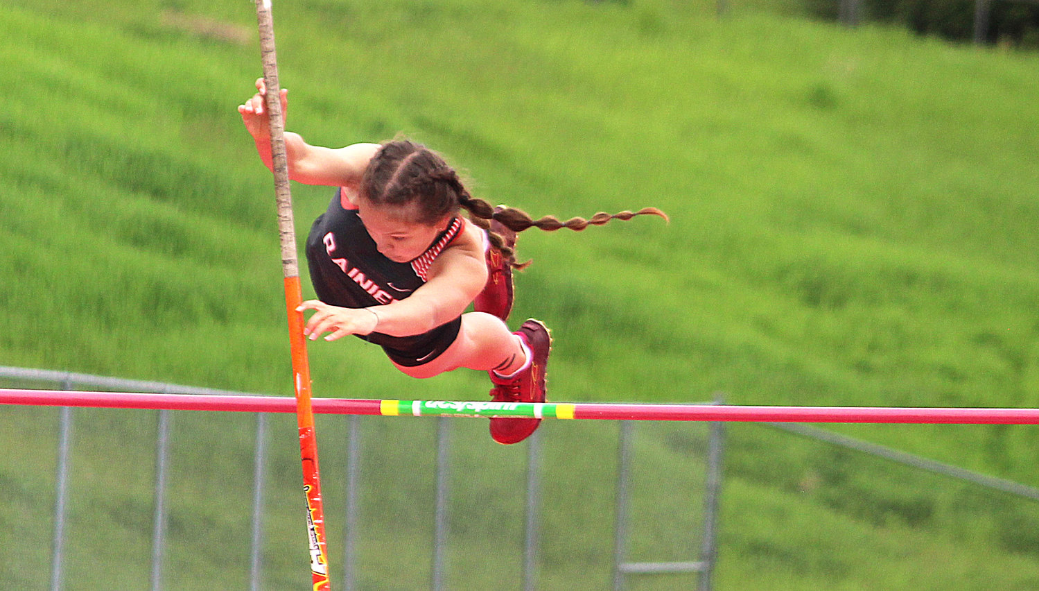 Rainier's Ella Marvin clears the pole vault bar during the State 1B/2B/1A Track and Field Championships in Cheney on Friday, May 27, 2022.