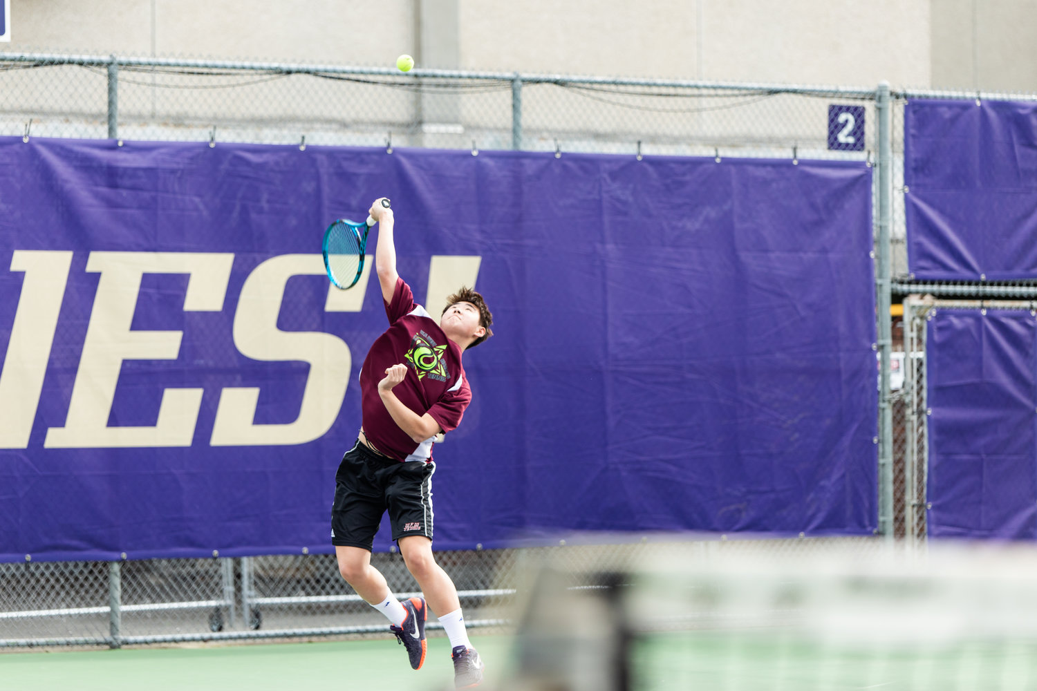 W.F. West's Javyn Han serves during the first set of the 2A boys' singles tennis state competition on May 27, 2022.