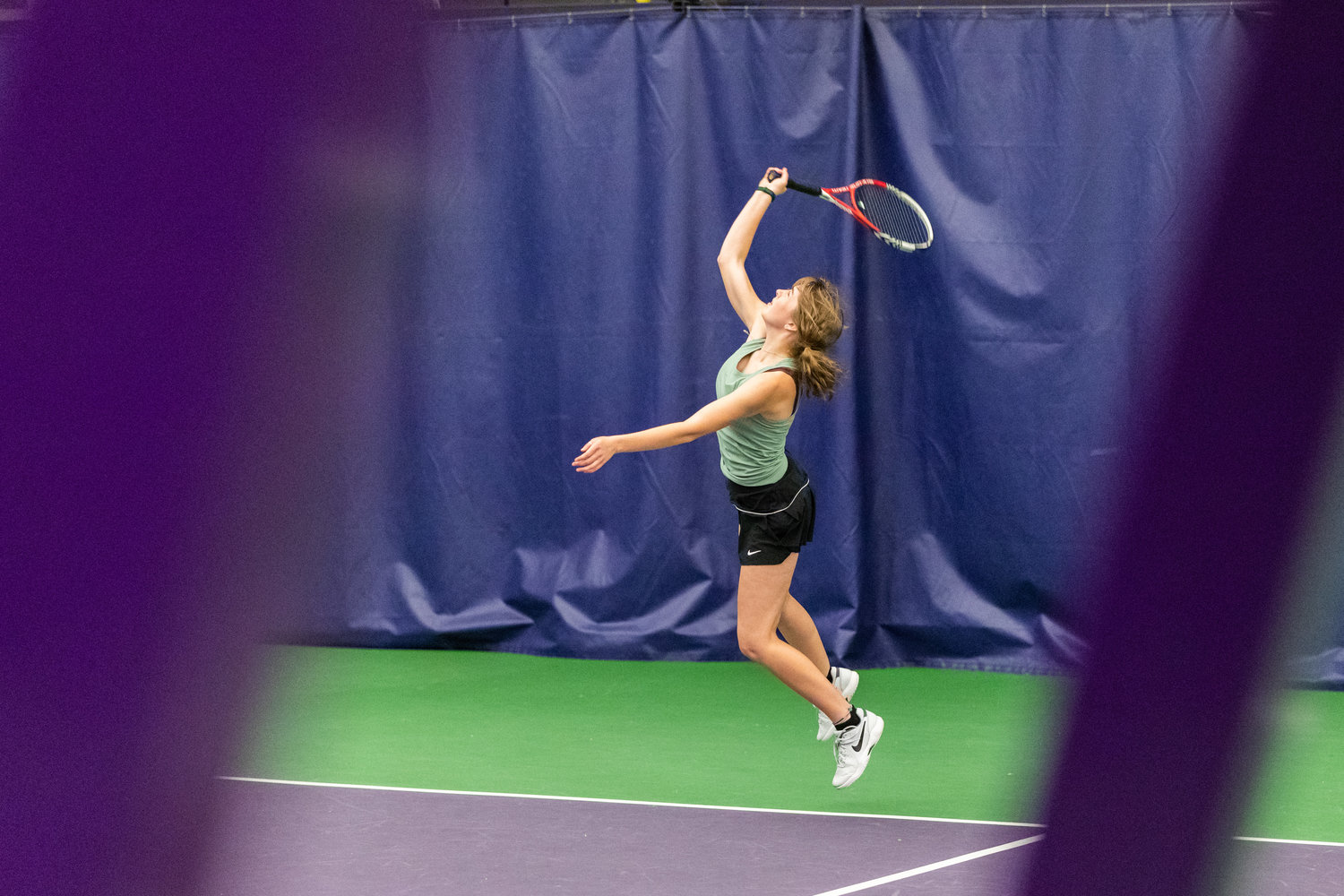 Centralia's Elizabeth Hopkins serves during the first set of the 2A girls' doubles tennis state competition on May 27, 2022.