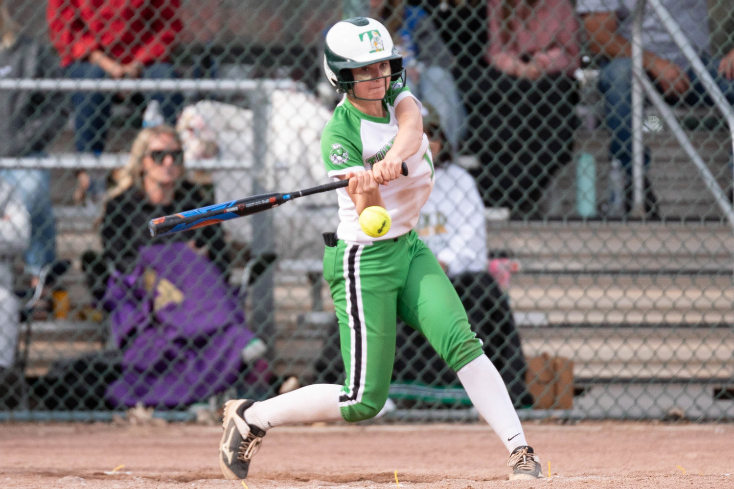 Tumwater's Aly Waltermeyer makes contact with a pitch against Lynden in the 2A State Quarterfinals at Carlon Park in Selah May 27.