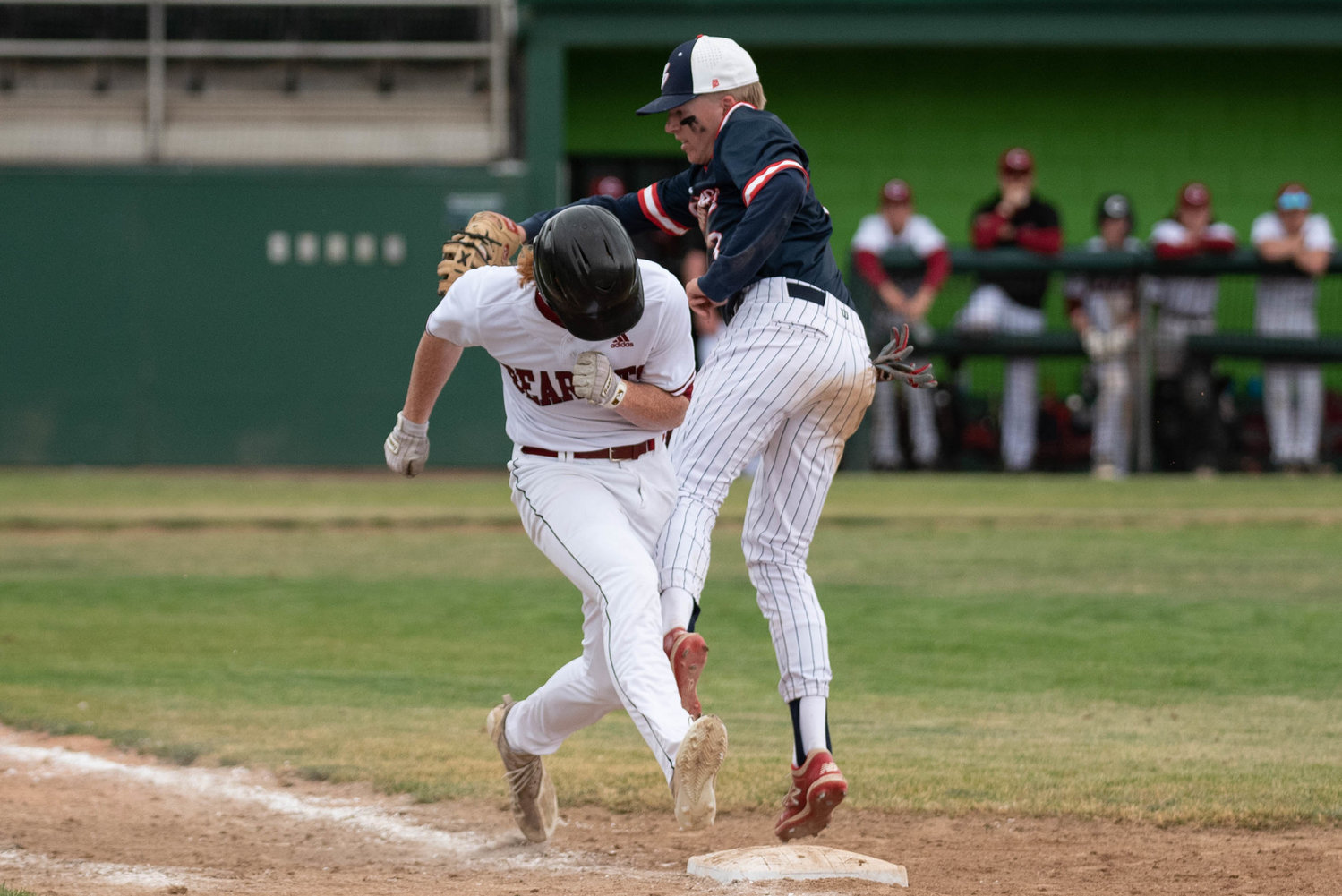 W.F. West outfielder Logan Moore stretches for first base while Ellensburg's Johnny Rominger tries to tag him out in the 2A State Baseball Third-Place Game at Yakima County Stadium May 28.