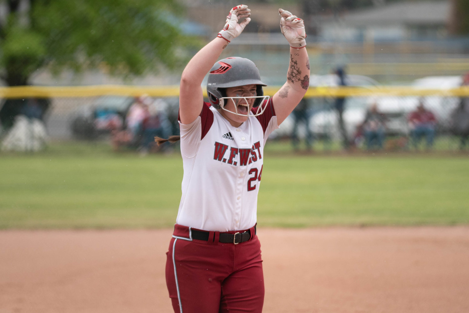 W.F. West first baseman Savannah Hawkins celebrates after a home run against Rochester in the 2A State Softball playoffs May 28 at Carlon Park in Selah.