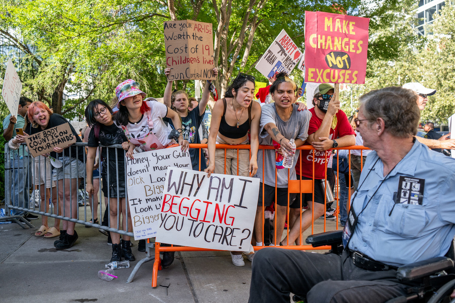 Gun control advocates confront a man passing by from the National Rifle Association annual convention at the George R. Brown Convention Center on Saturday, May 28, 2022, in Houston. (Brandon Bell/Getty Images/TNS)