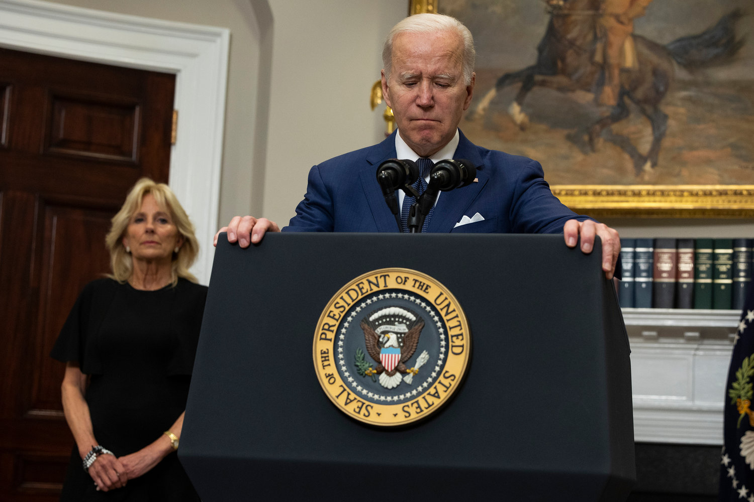U.S. President Joe Biden delivers remarks from the Roosevelt Room of the White House as first lady Jill Biden looks on concerning the mass shooting at a Texas elementary school on May 24, 2022, in Washington, DC. Eighteen people are dead after a gunman today opened fire at the Robb Elementary School in Uvalde, Texas, according to published reports. (Anna Moneymaker/Getty Images/TNS)