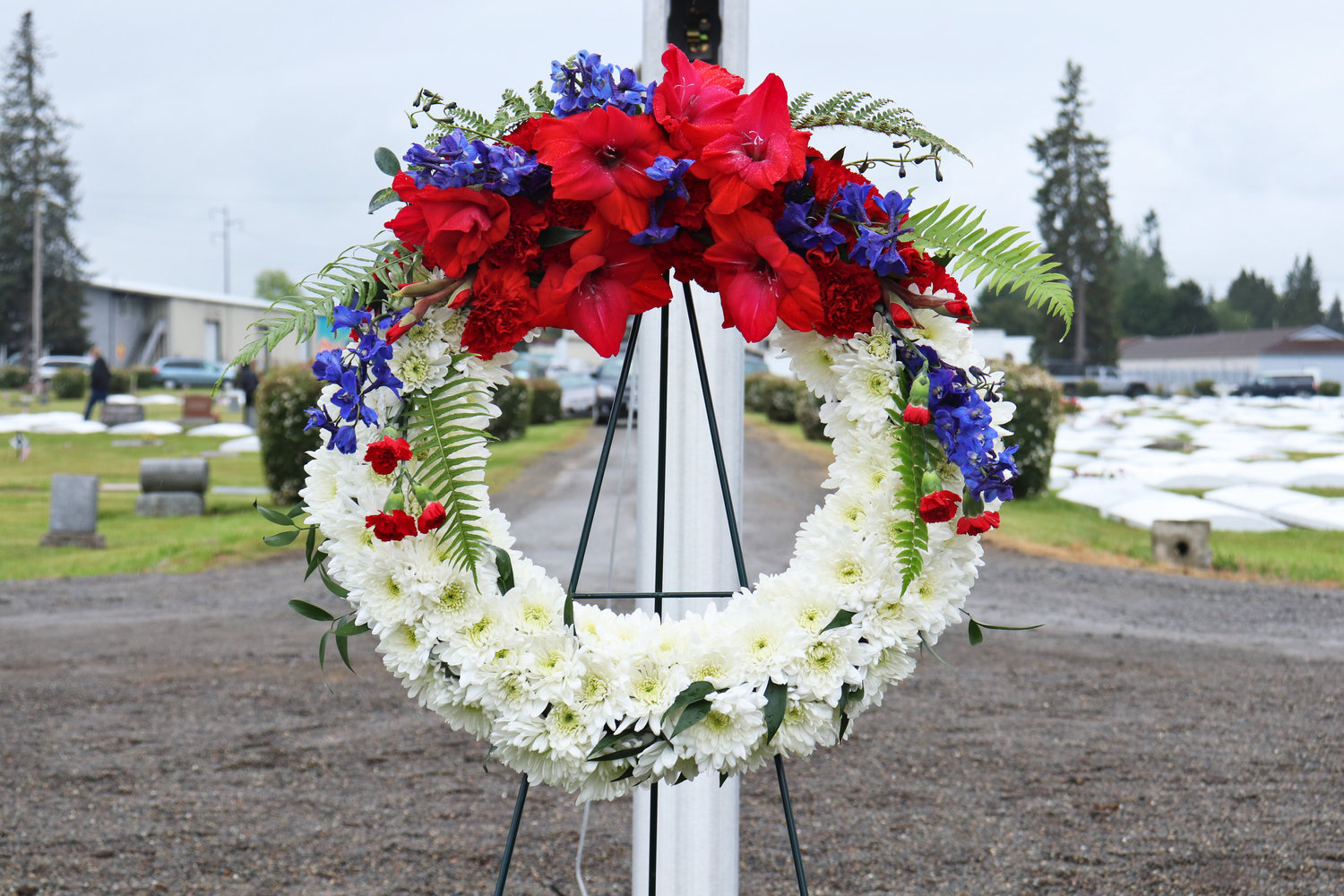 A memorial wreath adorns Sticklin Greenwood Memorial Park during a rededication ceremony on Saturday. Veterans of nearly every war are buried in the park’s historic cemetery, according to those who headed the restoration project.