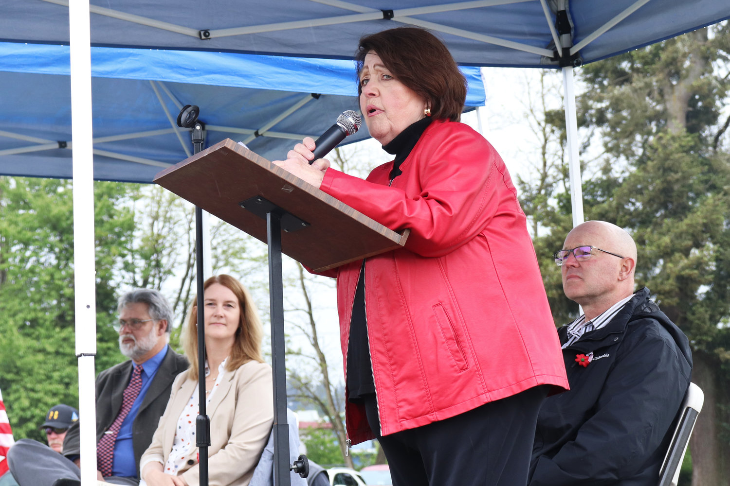 Marveen Rohr speaks on the restoration work completed at Sticklin Greenwood Memorial Park during a rededication ceremony on Saturday. Seated behind her are, from left, 20th District Rep. Ed Orcutt, Centralia Mayor Kelly Smith Johnston and Centralia City Manager Rob Hill.