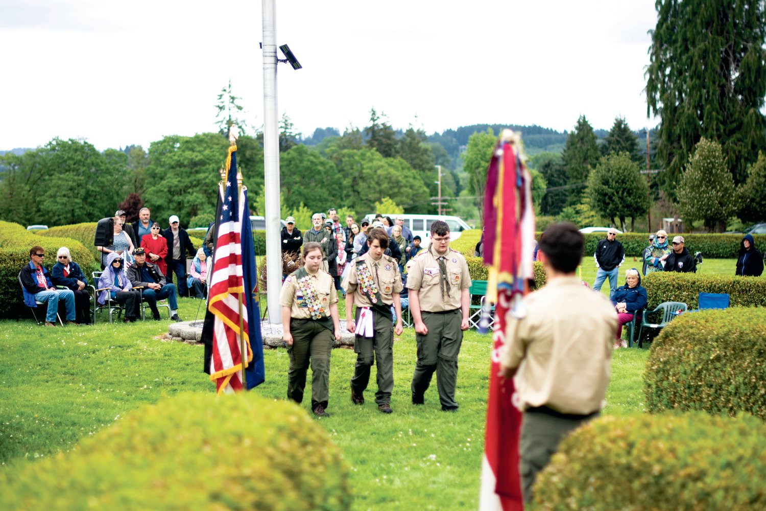 Members of Boy Scout Troop 373 walk back to their troop after laying a wreath during Monday’s Memorial Day ceremony at Claquato Cemetery. From left, Emme Prok, J. C. Mersereau and Austin Brannan.