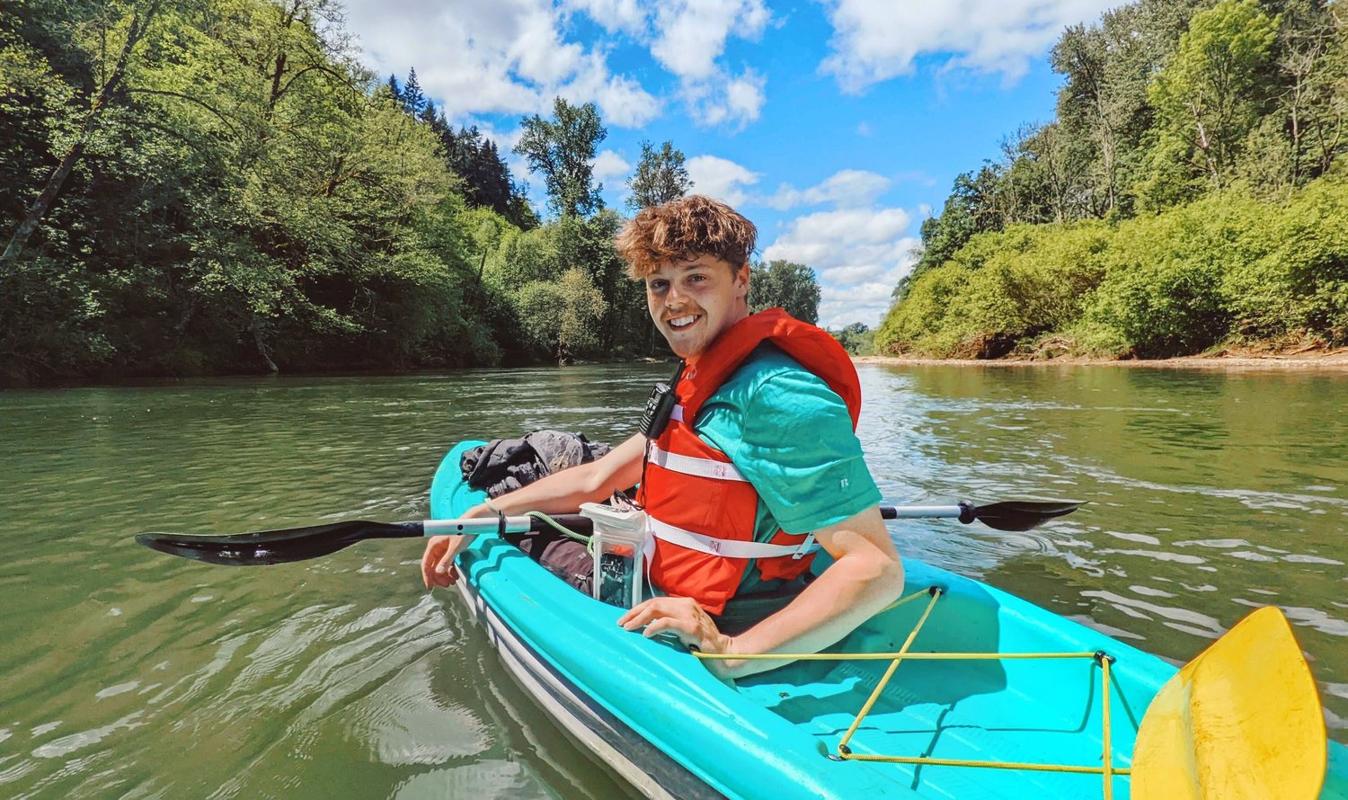 Chronicle Photojournalist Jared Wenzelburger looks to Reporter Isabel Vander Stoep as she snaps a photo while kayaking the Chehalis River near Centralia.