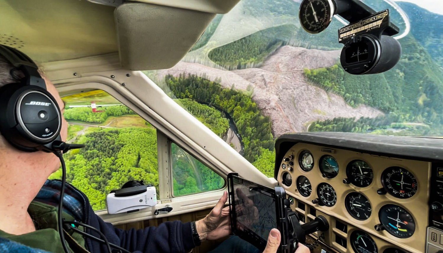 Dave Neiser pilots a Cessna Cardinal over the headwaters upstream of Pe Ell.