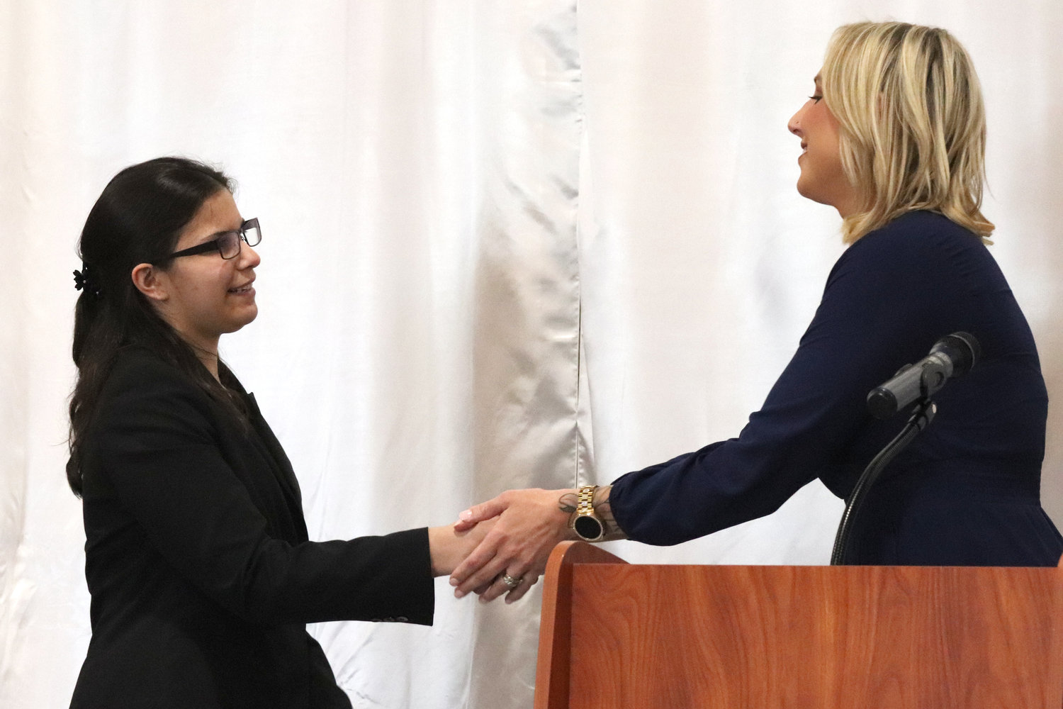 Centralia senior Annarazelle Garcia accepts a scholarship from Visiting Nurses during the Rob Fuller Top 25 Scholarship Luncheon in Chehalis on Monday.