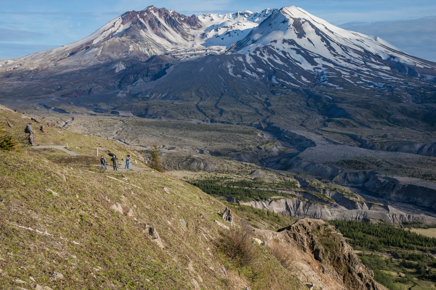 Hikers and mountain goats look on from the Mount Margaret Backcountry in the Gifford Pinchot National Forest on Wednesday near Mount St. Helens.