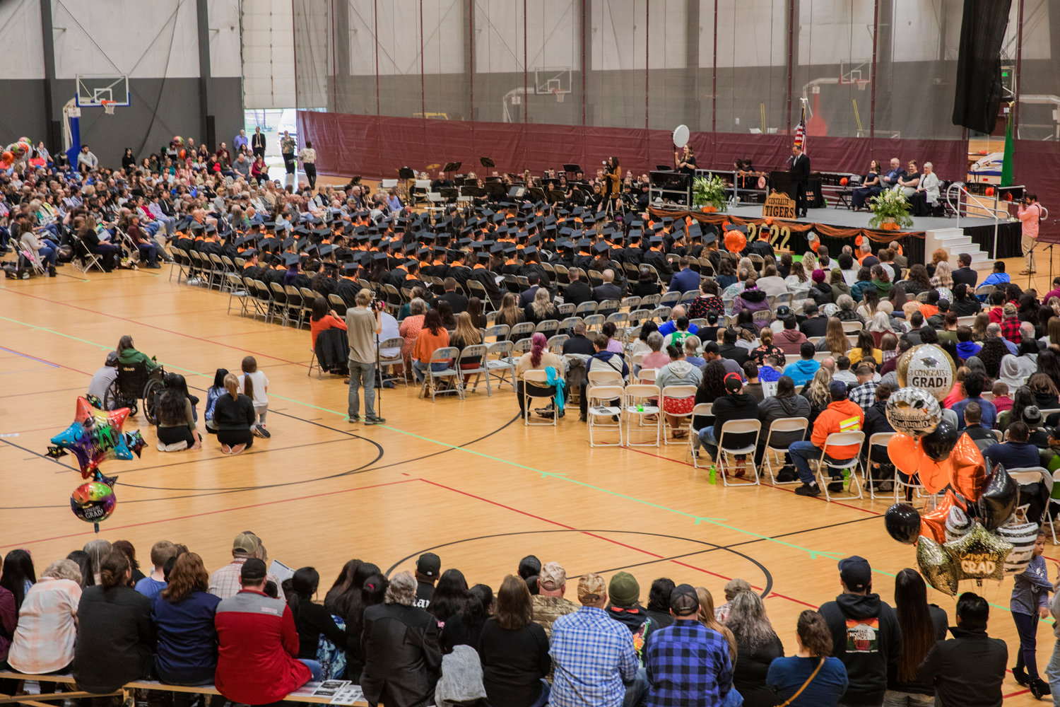 Graduates and attendees listen as Josue Lowe introduces speakers during a graduation ceremony in Centralia earlier this month.