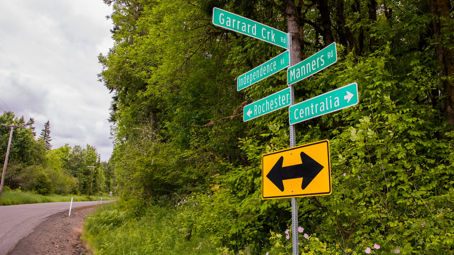 Road signs point in directions between Centralia and Rochester on Tuesday near Garrard Creek Road.