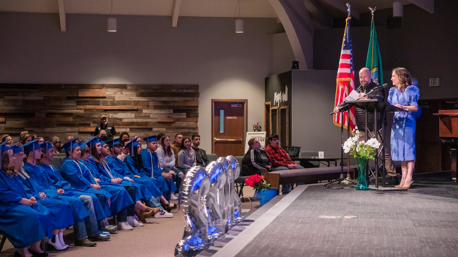 Superintendent Dr. Lisa Grant and James Bowers speak to graduates from Futurus High School Tuesday in Centralia.