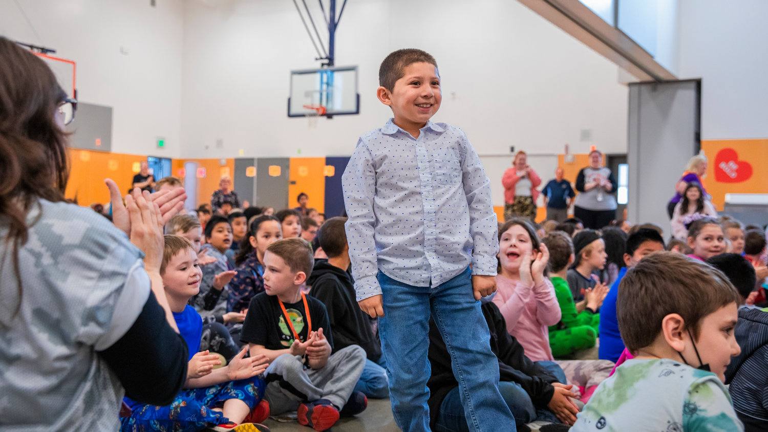 Yoe Rivas smiles and stands to be recognized as he receives the Noah Markstrom Award Friday morning at Fords Prairie Elementary in Centralia.