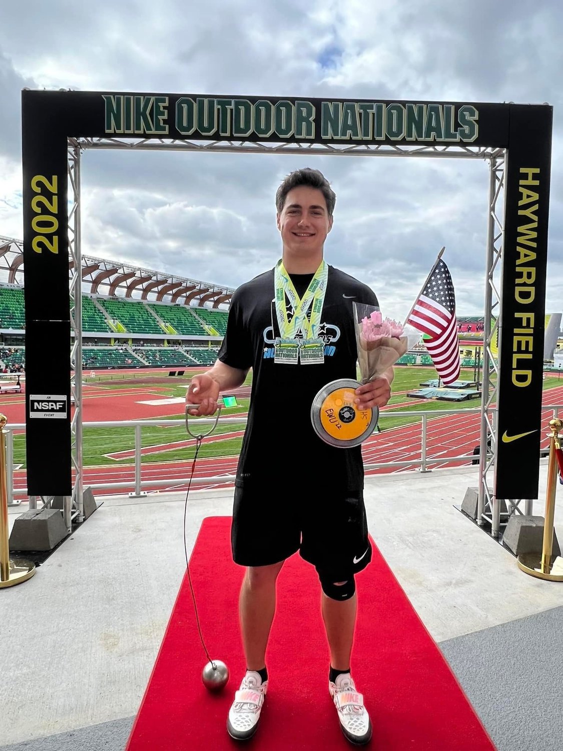 Rainier graduate Jeremiah Nubbe poses with his medals after winning both the hammer and discus at the 2022 Nike Outdoor Nationals meet in Eugene, Oregon at Hayward Field June 19.