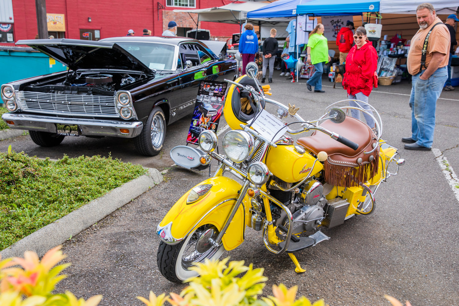 Vintage motorcycles and cars sit on display during the Winlock Custom Car Show on Saturday.