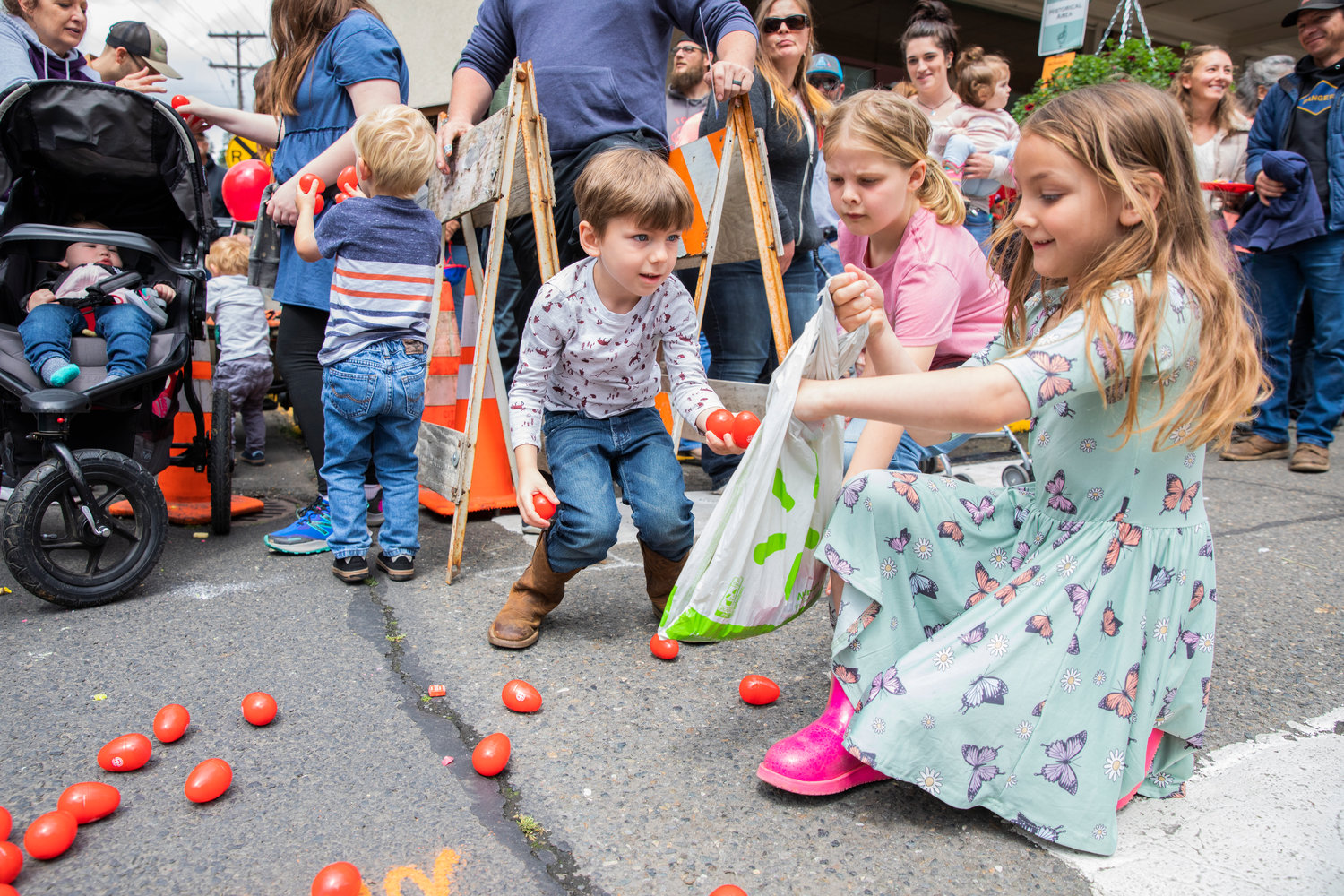 Kids stuff bags with plastic eggs full of candy during the Egg Days Festival parade in Winlock on Saturday.