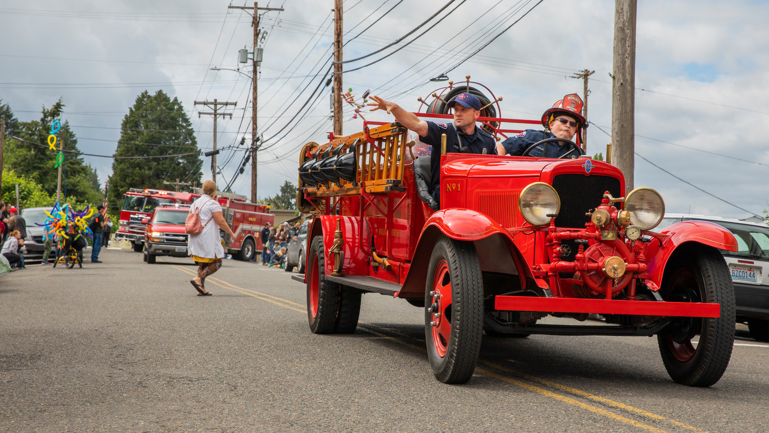 Candy is thrown from a vintage fire truck during the Egg Days Festival parade in Winlock on Saturday.