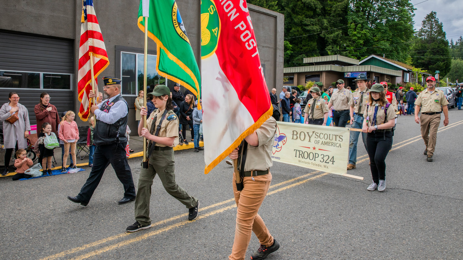 A color guard walks with flags in front of Winlock-Toledo Troop 324 during the Egg Days Festival parade on Saturday.
