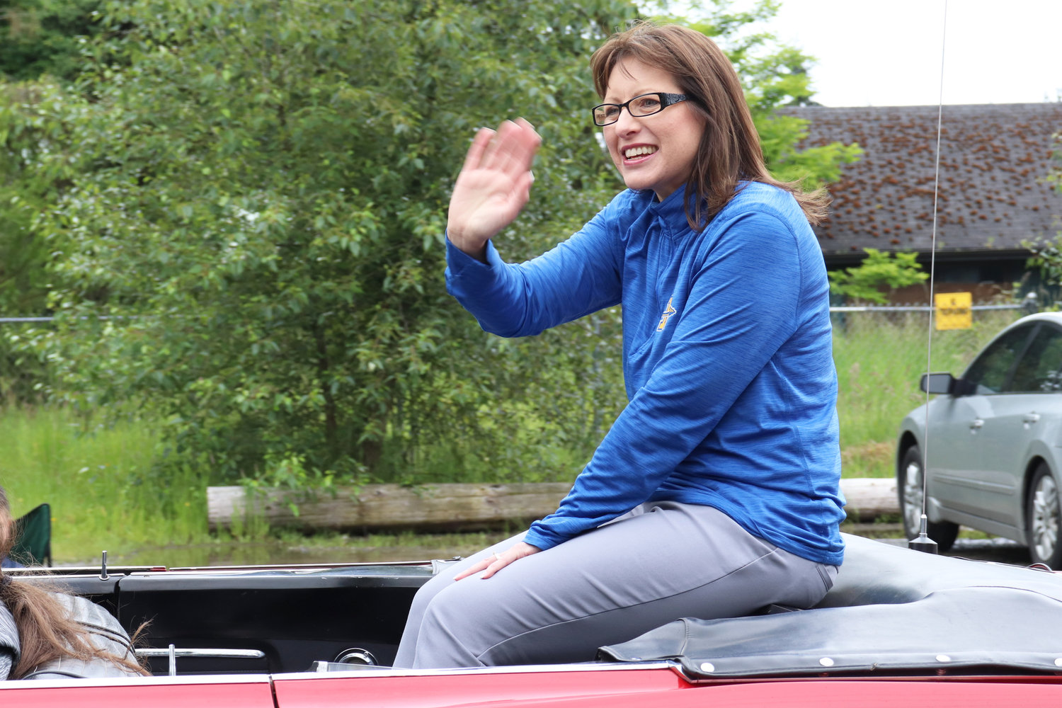 Departing Rochester School District Superintendent and Swede Day Grand Marshal Kim Fry waves during the Swede Day Parade in Rochester on Saturday.