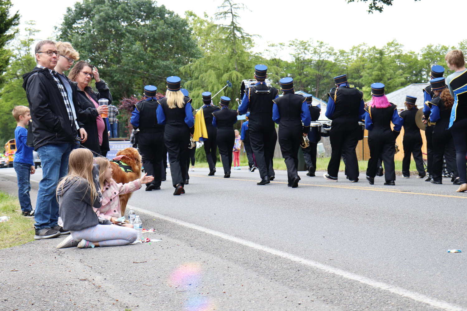 Spectators watch the Rochester High School marching band perform during the Swede Day Parade in Rochester on Saturday.