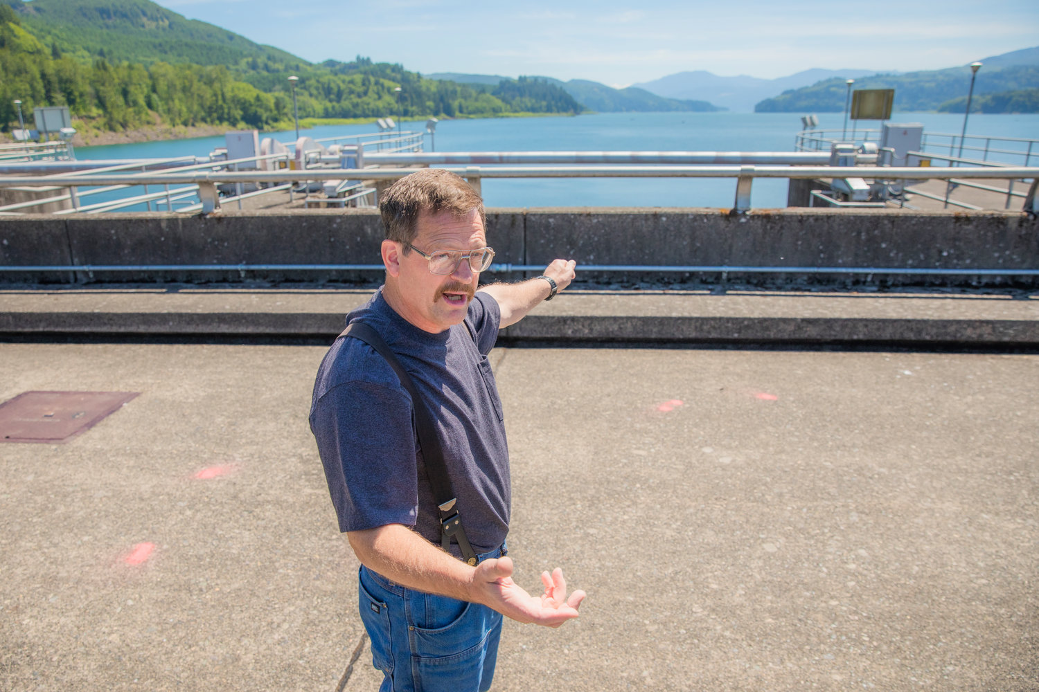 Clarence Lupo, journeyman at the Mossyrock Dam, talks about spill gates Tuesday morning.