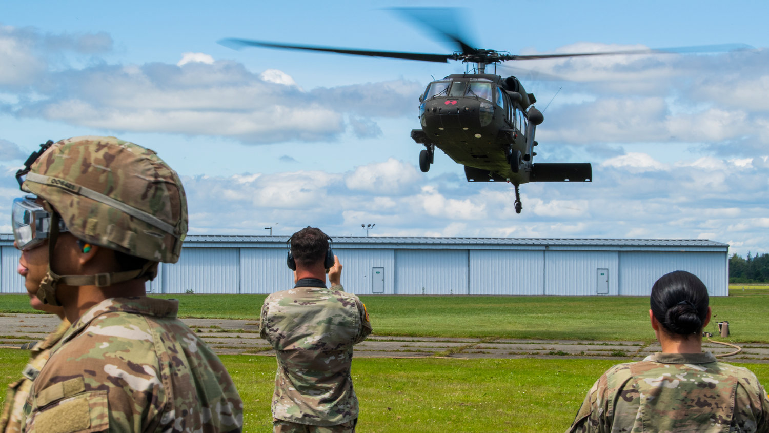 A Black Hawk helicopter from Joint Base Lewis-McChord hovers above the Chehalis-Centralia Airport on Wednesday afternoon. The airport hosted training exercises focused on refueling helicopters.