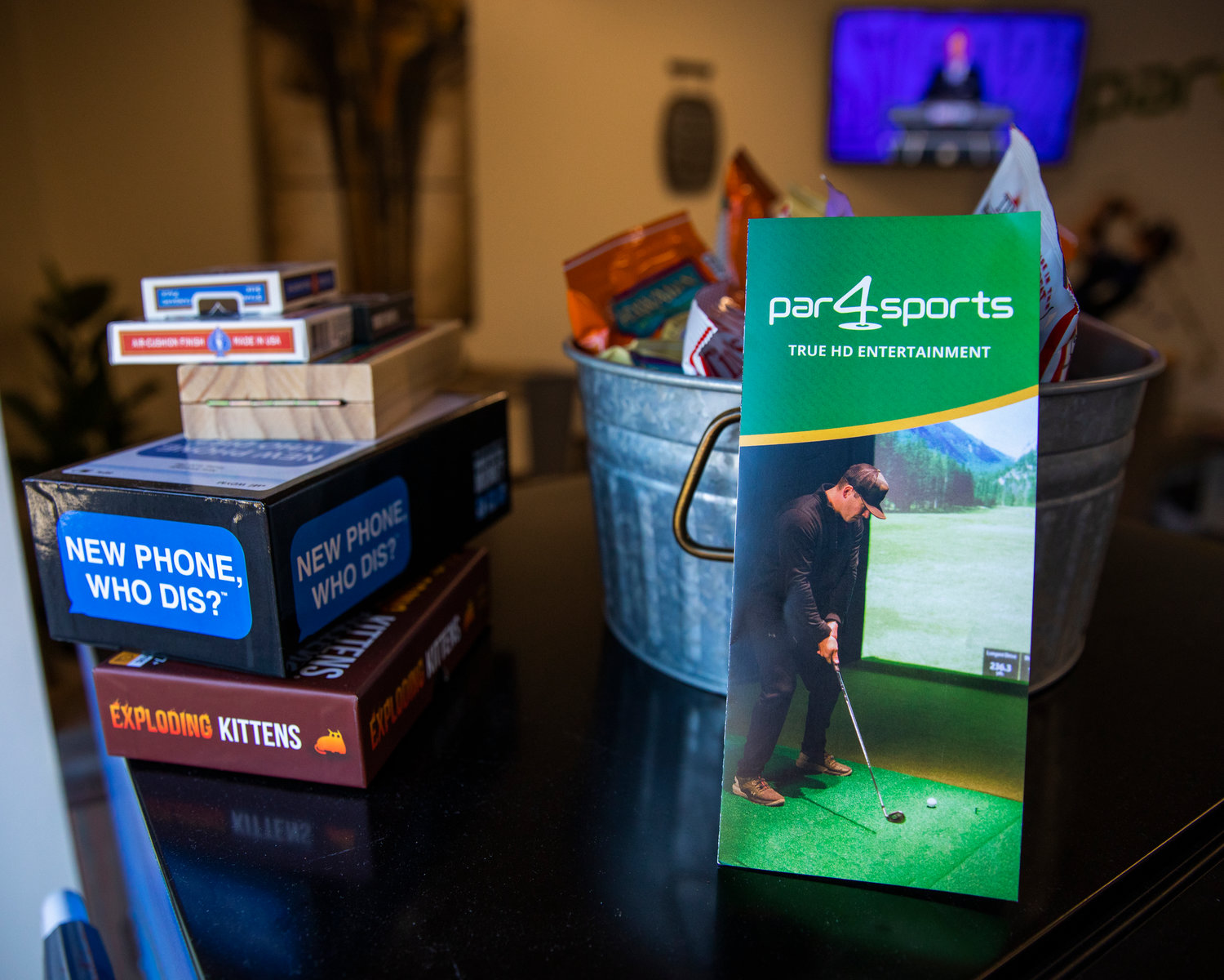 A pamphlet displays photos during a ribbon cutting ceremony at Par 4 Sports in Centralia on Thursday.