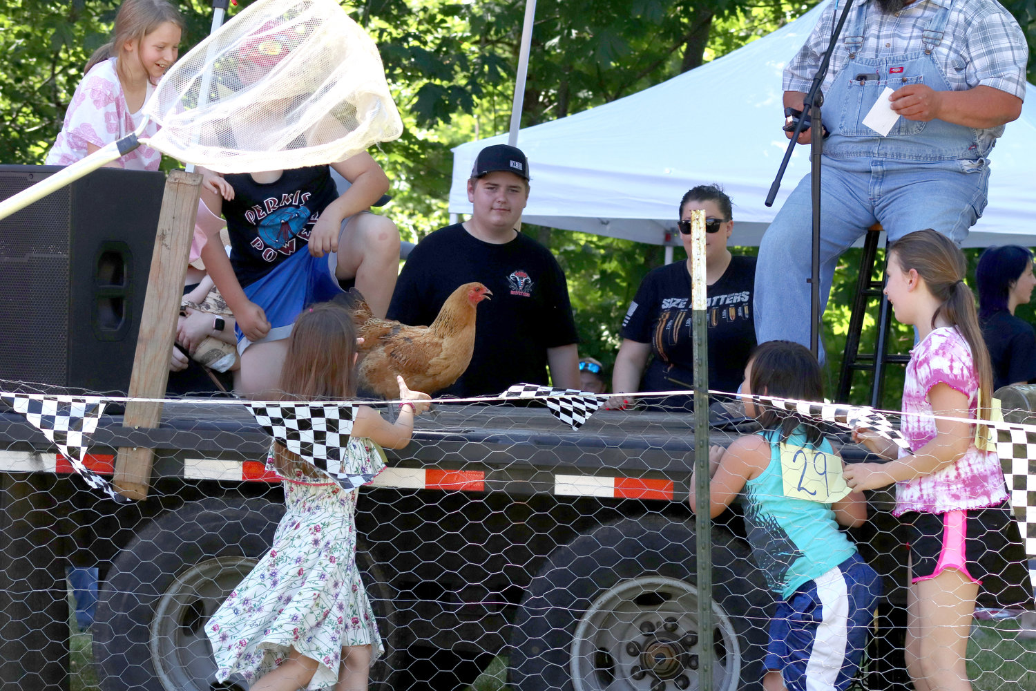 Kids chase after a runaway chicken who made its way onto the stage during Independence Valley Community Hall’s 42nd Annual Chicken Races in Rochester on Sunday. No chickens were harmed during the event, which is a fundraiser for Independence Valley Community Hall.