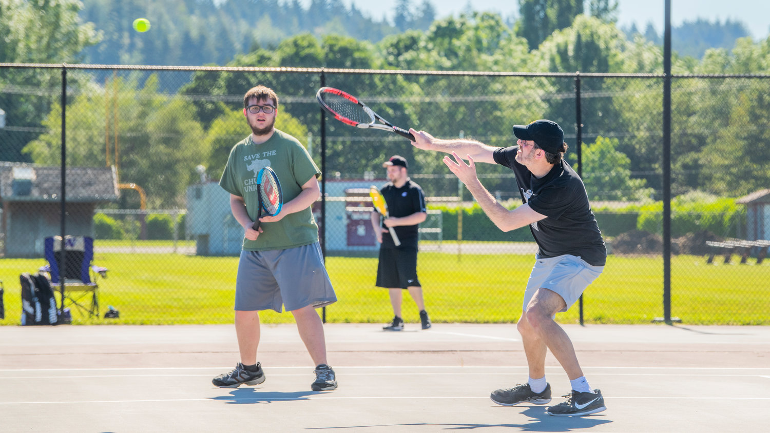 T.J. Underwood, W.F. West standout and teaching pro at Thorbeckes, returns a shot while playing doubles with Cade Cameron during the Jack State Tennis Tournament in Olympia on Saturday.