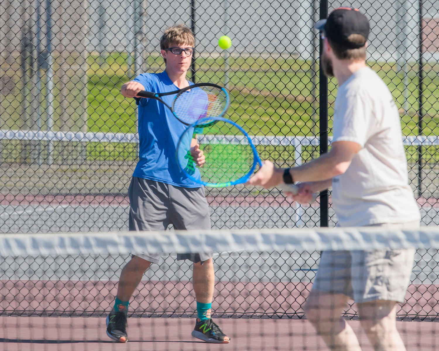 Sam and Brian Mittge play doubles during the Jack State Tennis Tournament at W.F. West High School on Saturday.