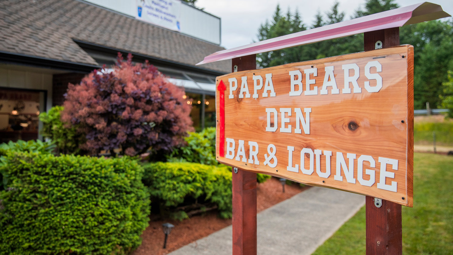 Papa Bears Den Bar & Lounge features a back entrance located off U.S. Highway 12.