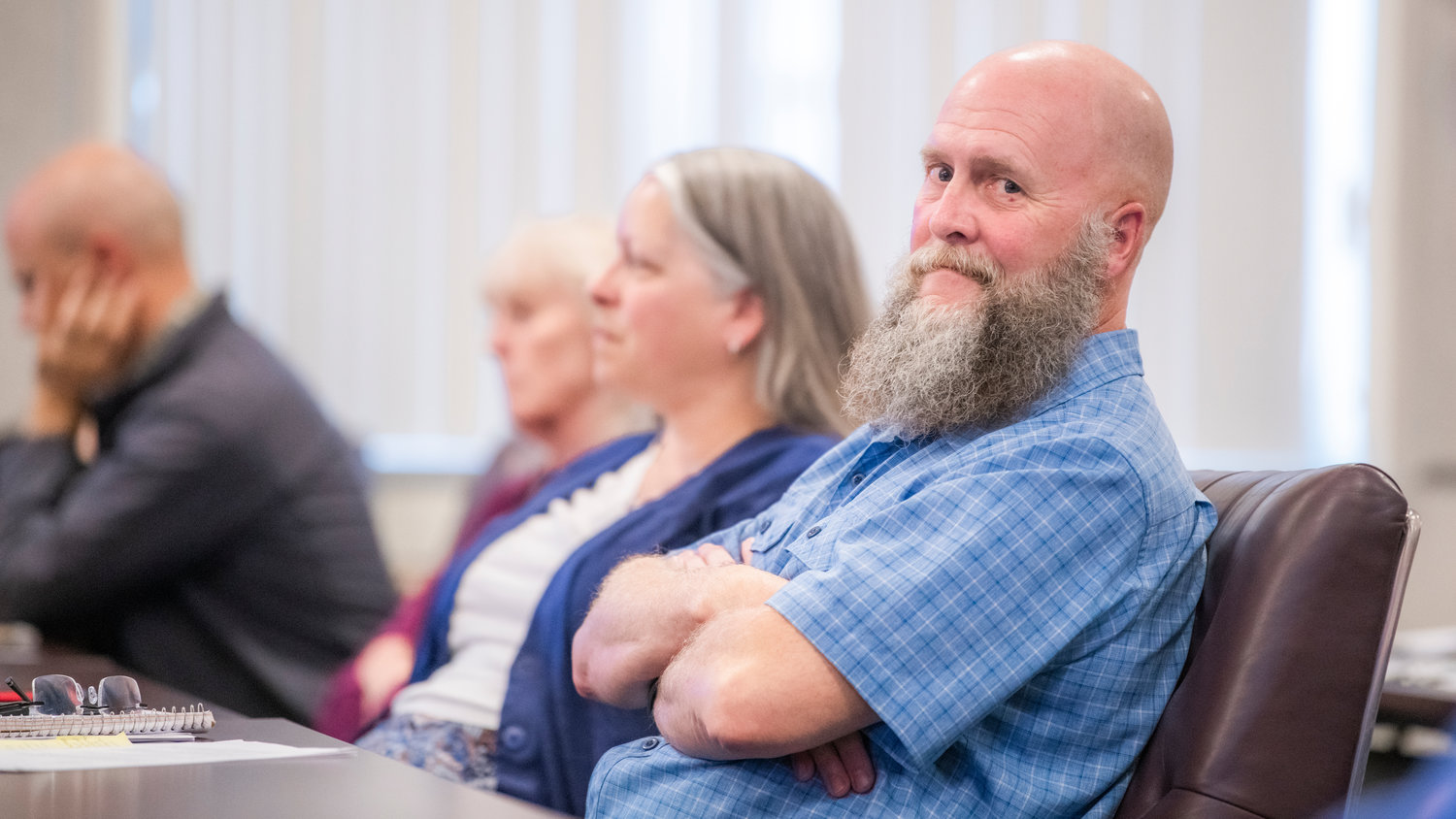 Shawn Seeger, a Mineral resident, attends a Lewis County Planning Commission meeting at the courthouse Tuesday evening during a workshop on a rezone proposal north of Mineral Lake.