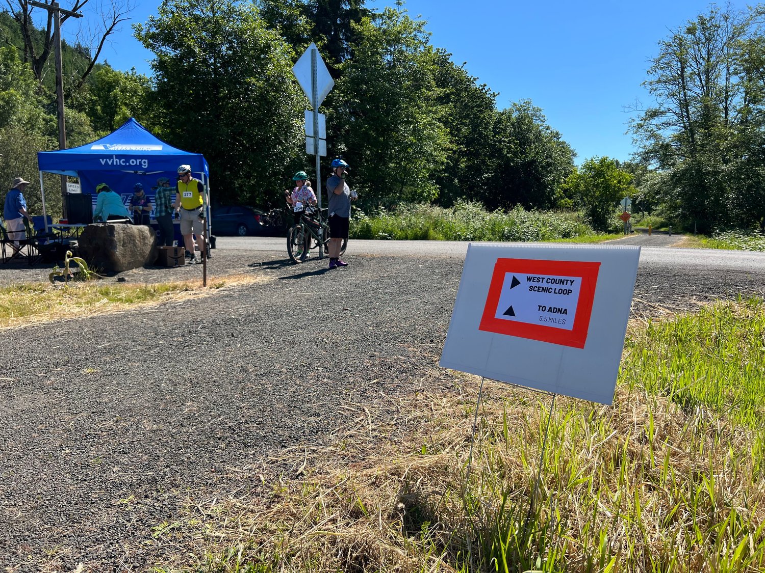 A sign shows two different routes for riders to take at the intersection of the Willapa Hills Trail and Ceres Hill Road. For the first time in RTW's history, road routes were added to combine with trail riding for a hybrid experience.