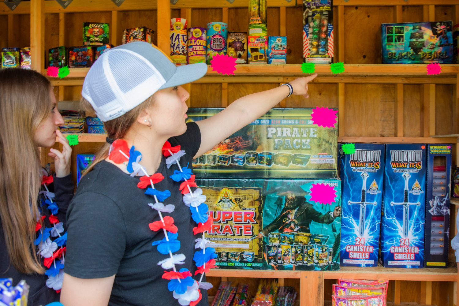 Abby McAuley points to pirate-themed fireworks while helping to raise money for the 2023 senior class at Adna High School Friday afternoon.