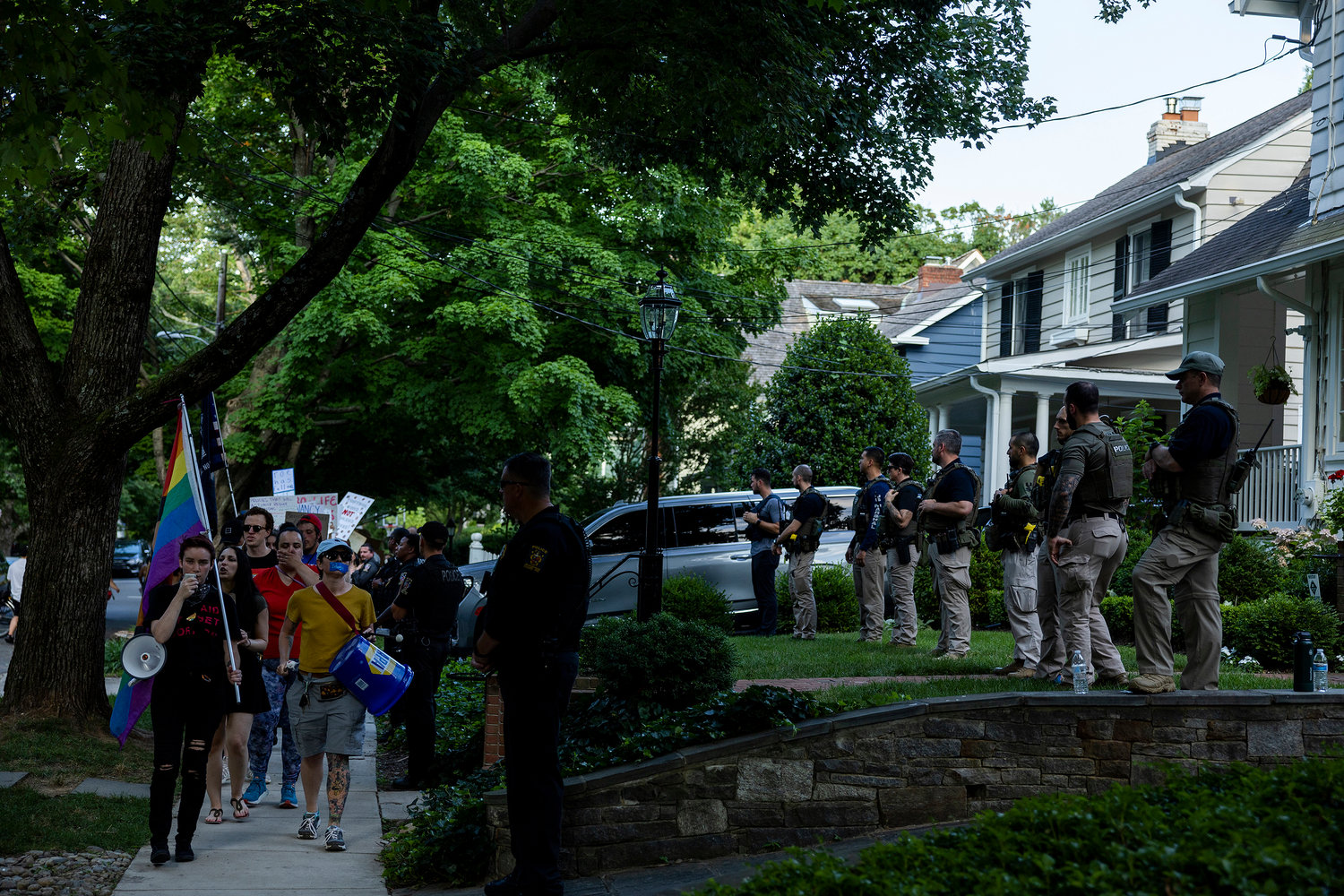 Law enforcement officers stand guard as abortion rights activists with Our Rights DC march in front of Supreme Court Justice Brett Kavanaugh's house on June 29, 2022, in Chevy Chase, Maryland. (Anna Moneymaker/Getty Images/TNS)