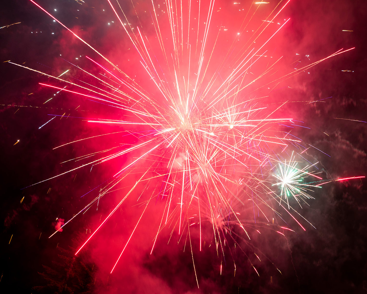 Fireworks explode and illuminate the sky Saturday over Packwood.