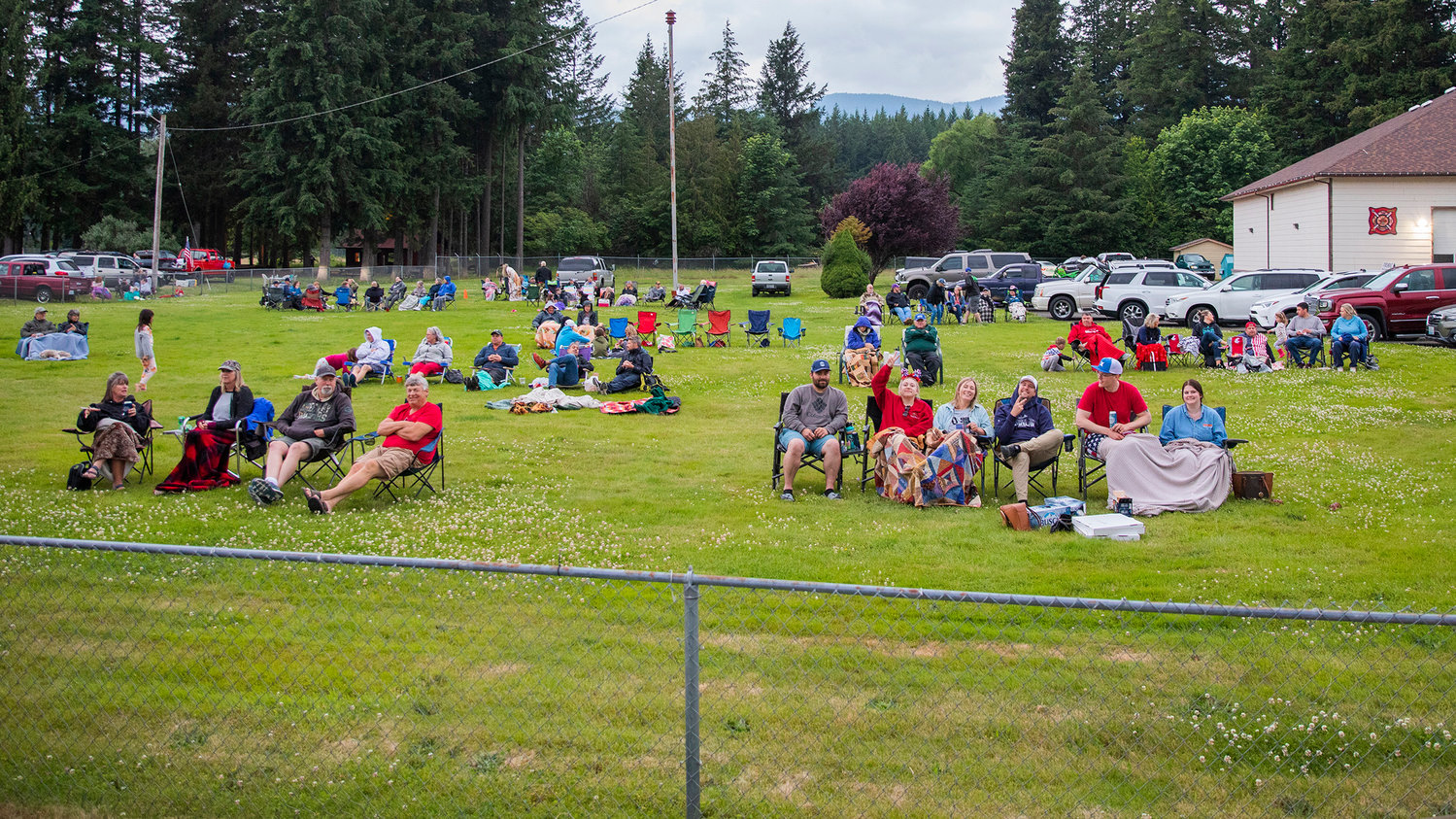 Visitors gather at dusk to watch a firework show put on by Lonnie Goble, the Packwood Fire Department and community donations.
