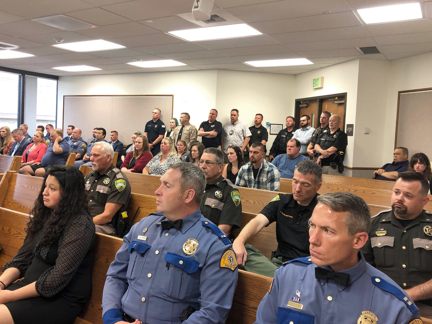Members of the community and local law enforcement fill the courtroom during William Thompson’s sentencing hearing in Chehalis on Tuesday. Thompson was convicted June 21 for the murder of Washington State Patrol Trooper Justin Schaffer.