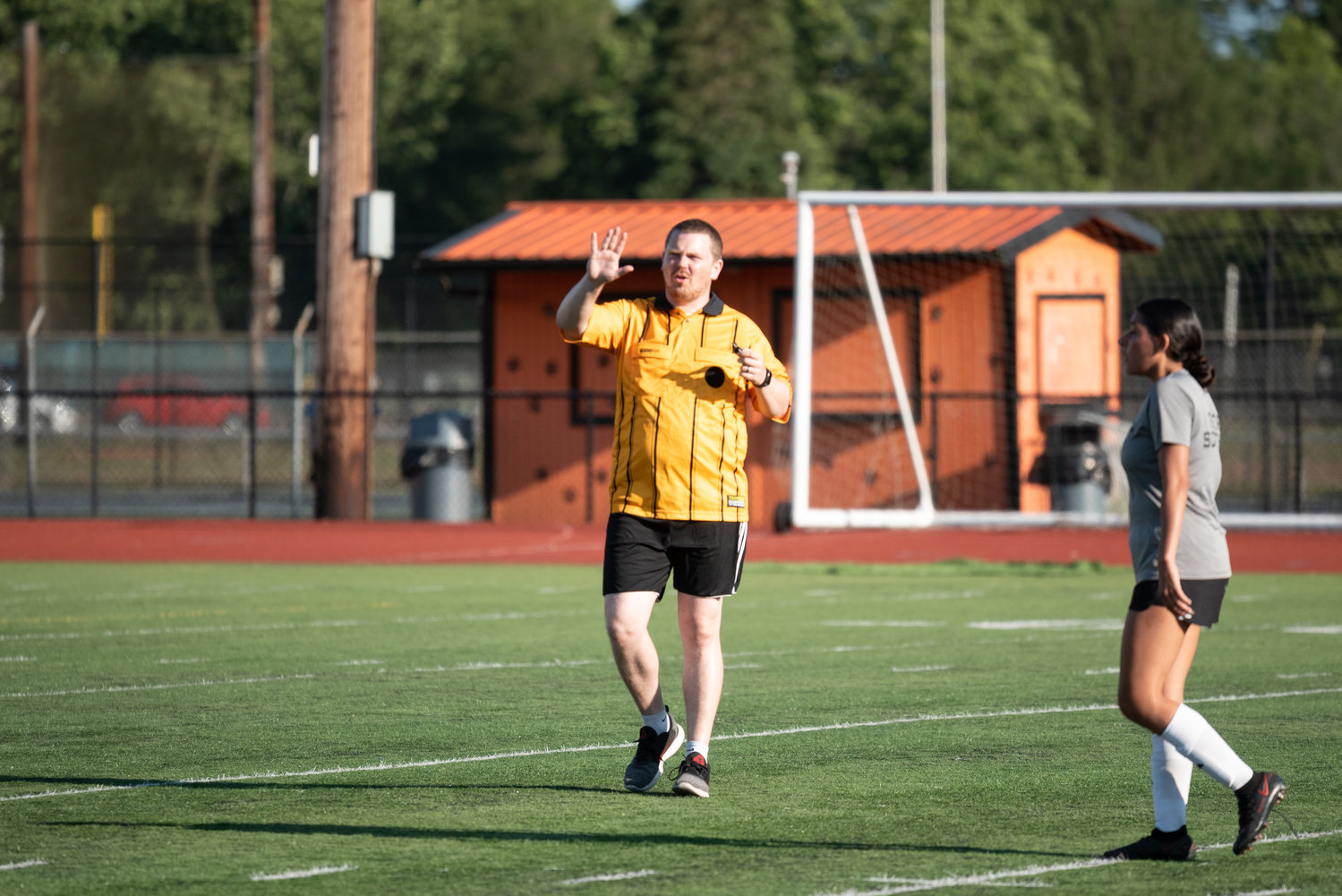 Former Tenino coach Kevin Schultz officiates a scrimmage between the Beavers and Centralia at Tiger Stadium Thursday.