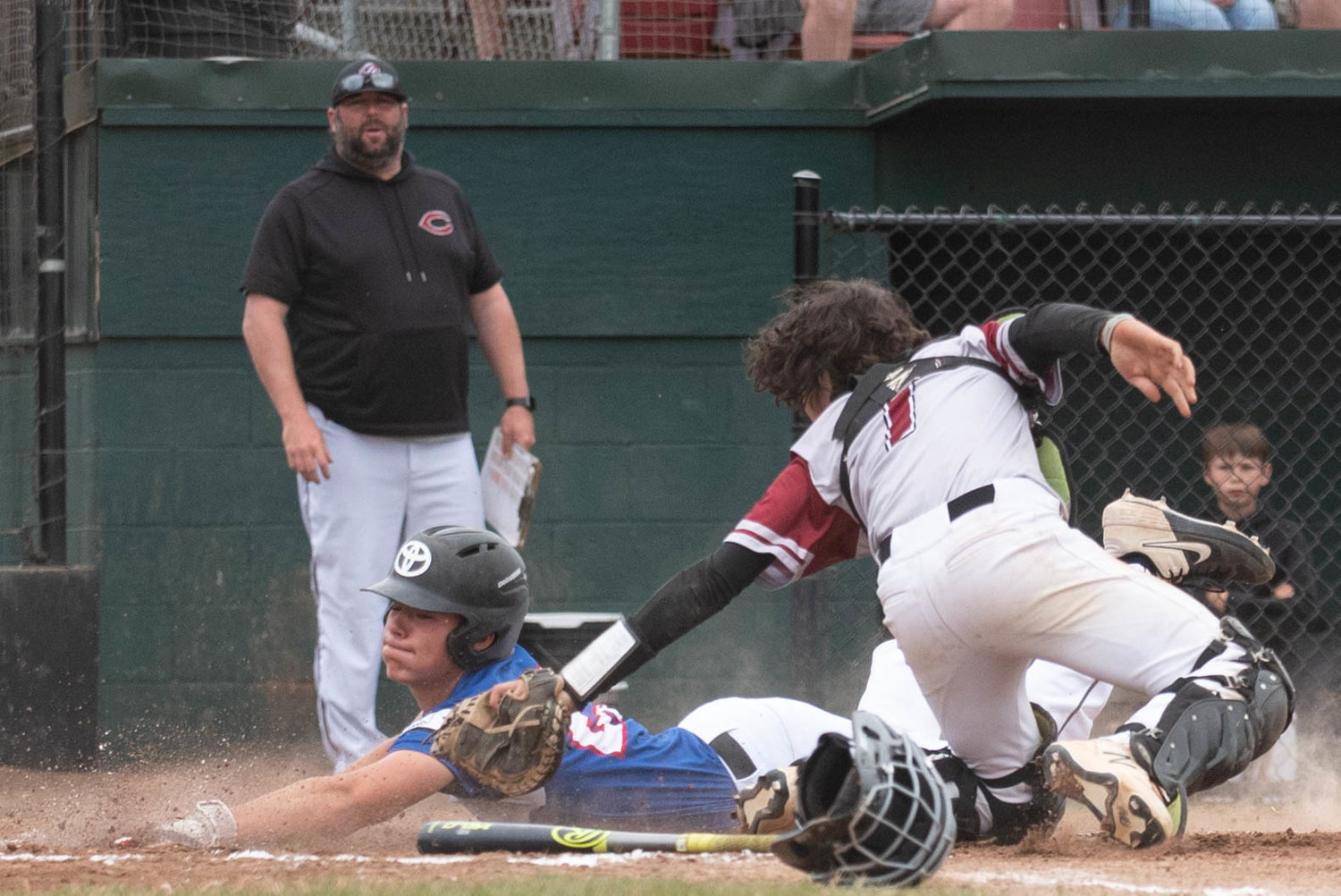 Asher Guerrero (left) is tagged out by Alex Stafford (right) during I-5 Jeep Renegades' Brian Cox Tournament semifinal against I-5 Toyota Mountain Dew July 17 at Ed Wheeler Field.