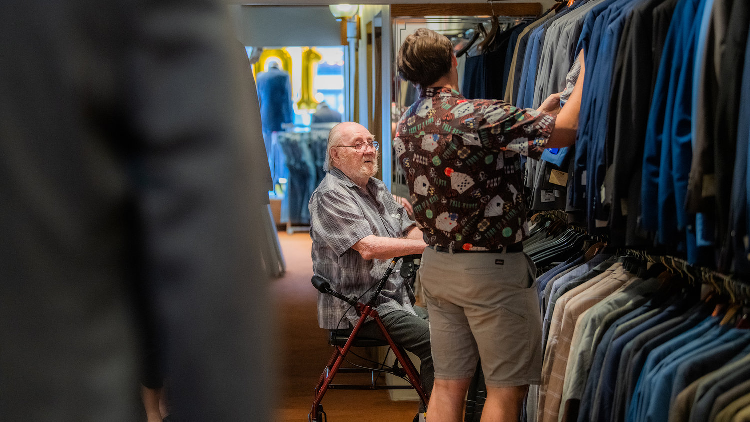 An employee helps a customer in finding a suit at Bartel's in Chehalis Tuesday afternoon.