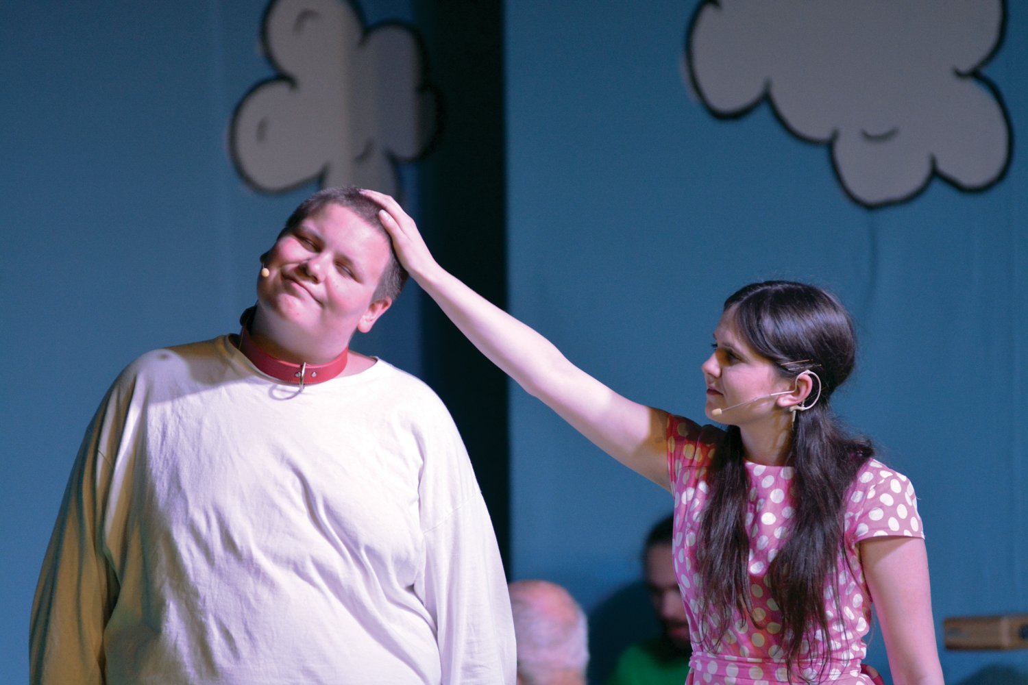 Sally Brown gives a pat on the head to Snoopy in a scene during “You’re a Good Man, Charlie Brown,” on July 28.